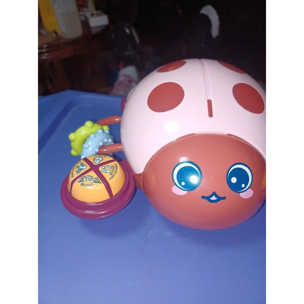 NIB Multi function  educational Lady bug for ages 6 months & up sings